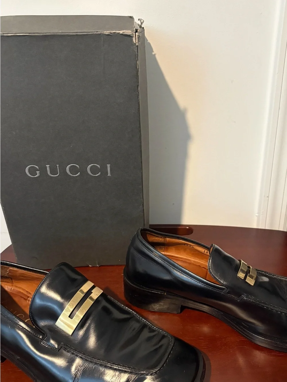 Gucci Black Leather Slip-On Loafers with Gold Plaque